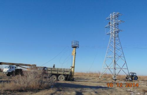 Reconstruction of PL -35 kw at transport interchange two levels at intersection Akkyr Zhalagash.  Wire hanging PL-35 kw at post 