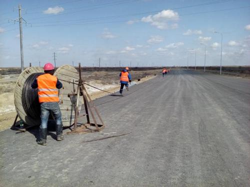 Traffic interchange. Cable illumination installation left side of road Akkyr-Zhalagash 