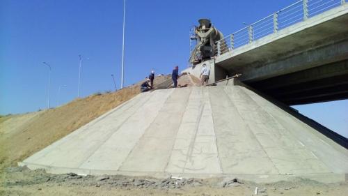 Overpass at traffic interchange. SP196+51,69. Protection of slopes cone by monolithic concrete