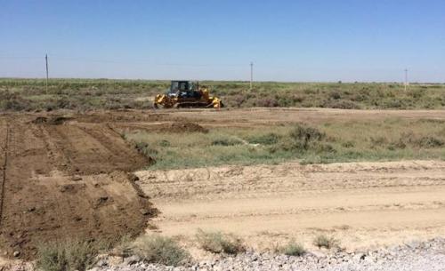 Photo No.2 Planning of earth outside of borders of construction camp at section SP 1115+00-SP1125+00 on left lane of the road