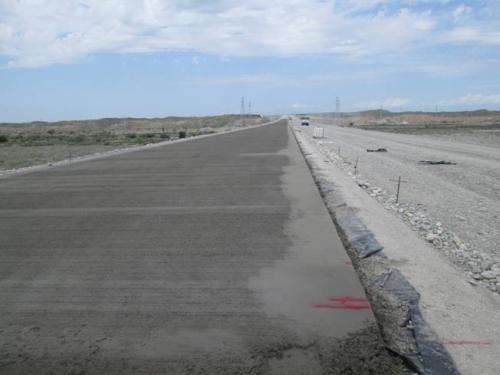 Cement concrete pavement construction at PK 864+60 - PK 884+00